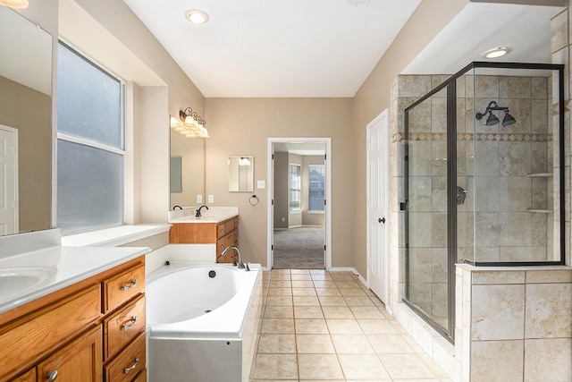 bathroom featuring tile patterned floors, vanity, and independent shower and bath