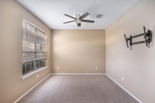 carpeted spare room with ceiling fan and lofted ceiling