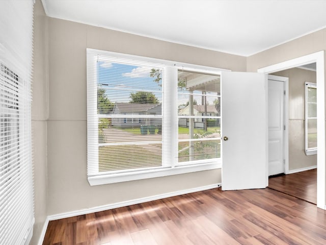 unfurnished room featuring hardwood / wood-style flooring