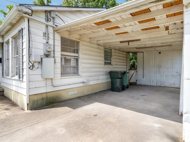 view of property exterior featuring a carport