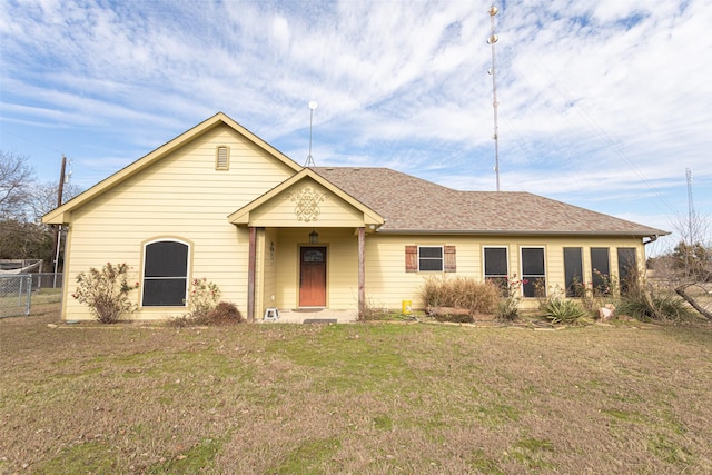 ranch-style home featuring a front yard