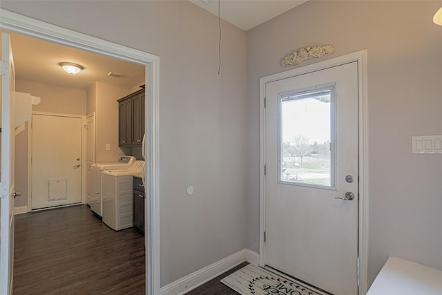 doorway to outside featuring dark wood-type flooring and washing machine and clothes dryer