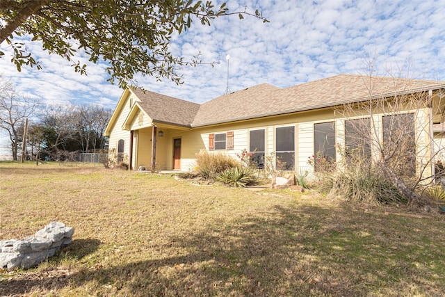 view of property exterior featuring a lawn