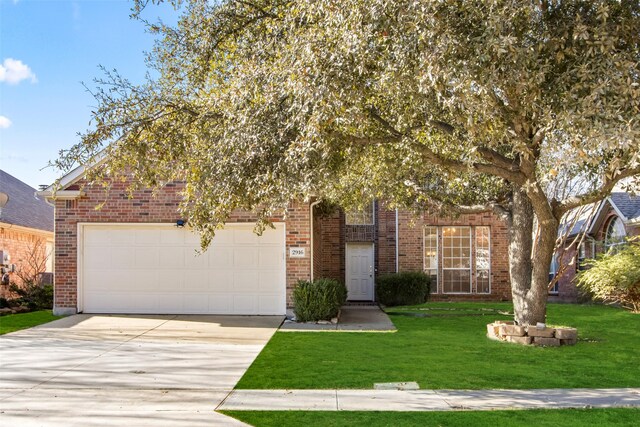 obstructed view of property featuring a garage and a front lawn