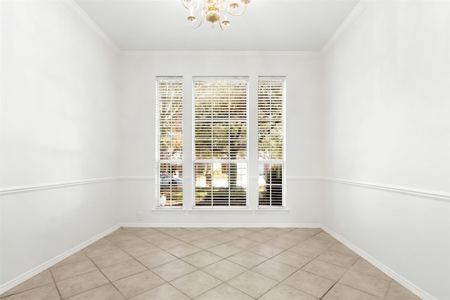 tiled spare room with an inviting chandelier and ornamental molding