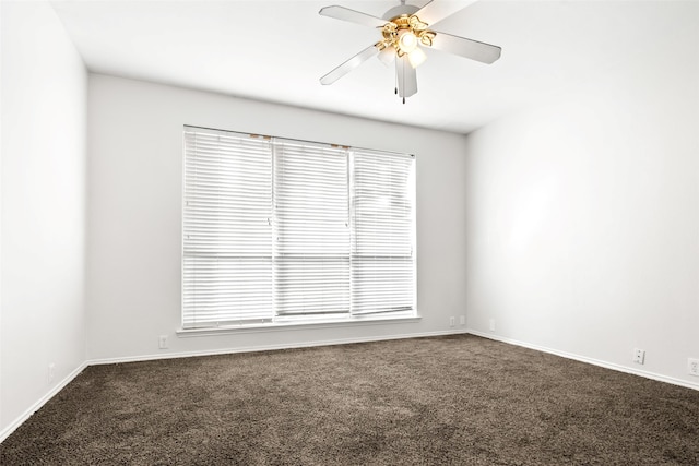 carpeted spare room with plenty of natural light and ceiling fan