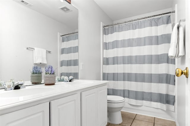 full bathroom with vanity, shower / bath combo, tile patterned floors, and toilet