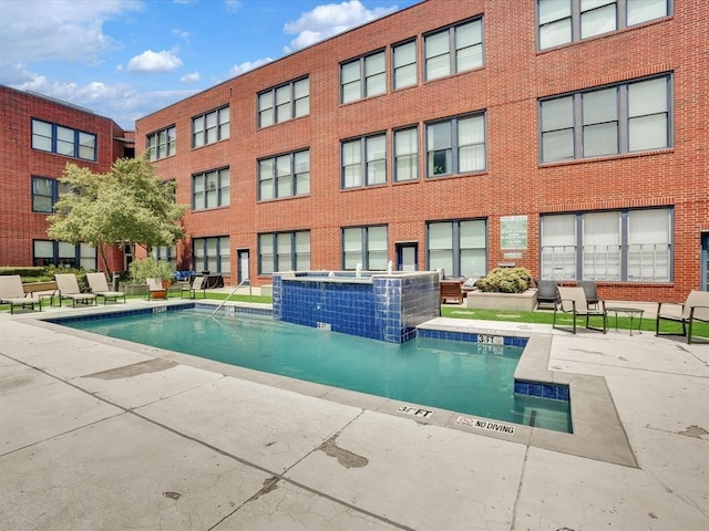 view of pool with pool water feature