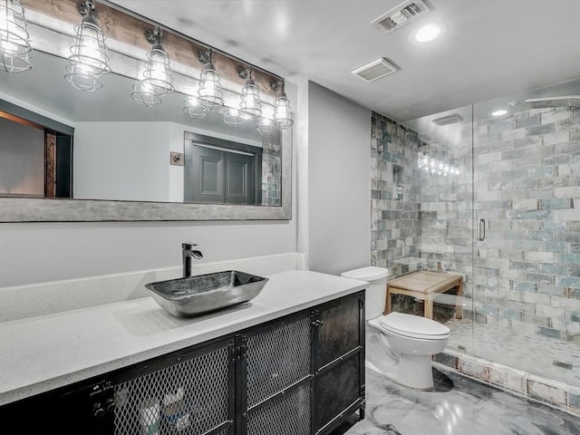 bathroom featuring toilet, vanity, and walk in shower