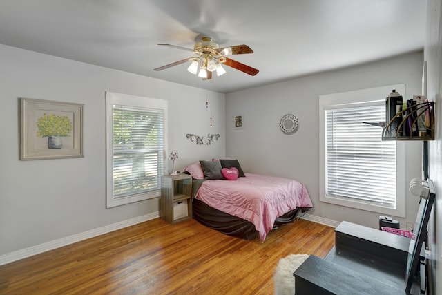 bedroom featuring wood-type flooring and ceiling fan