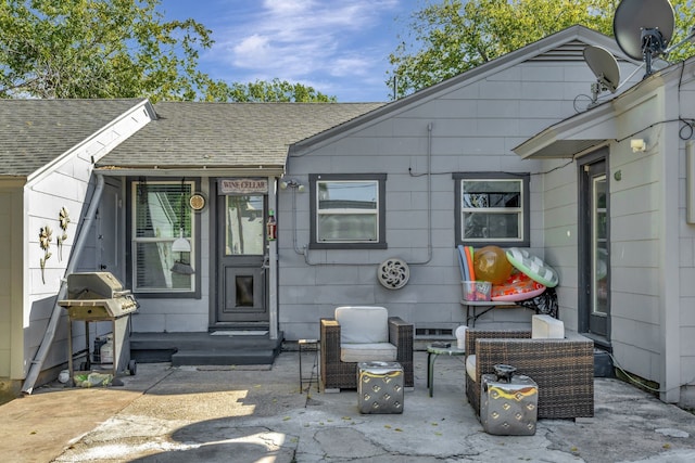 doorway to property with a patio area