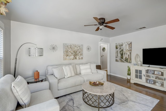 living room featuring ceiling fan and wood-type flooring