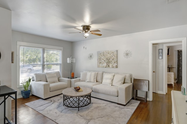 living room with ceiling fan and hardwood / wood-style flooring