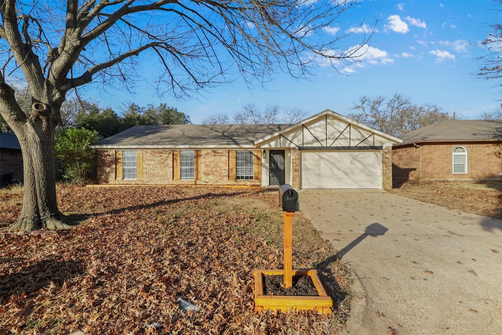 ranch-style house featuring a garage