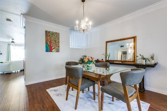 dining area with ceiling fan with notable chandelier, dark hardwood / wood-style flooring, and ornamental molding