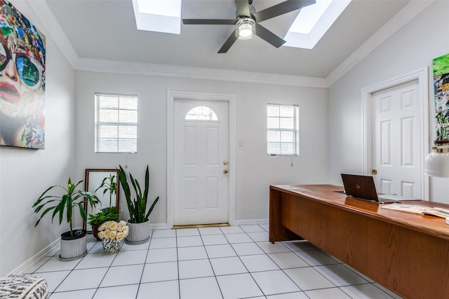 foyer with light tile patterned floors, plenty of natural light, ornamental molding, and a ceiling fan