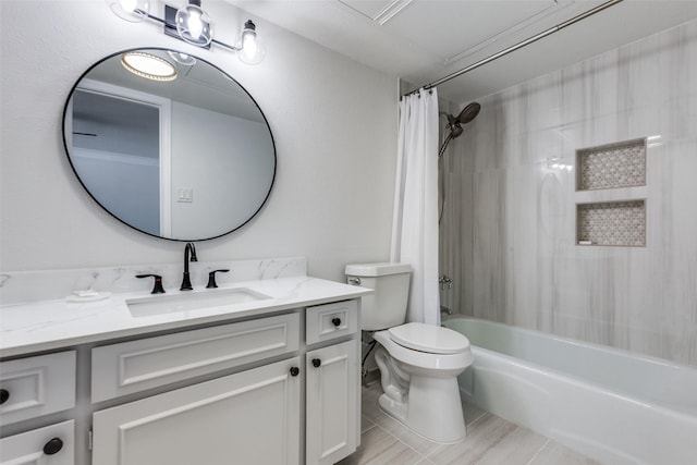 bathroom featuring toilet, shower / tub combo, and vanity