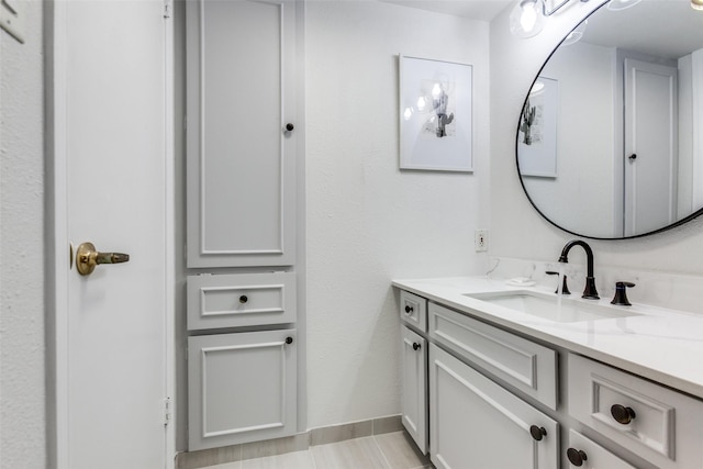 bathroom featuring baseboards and vanity