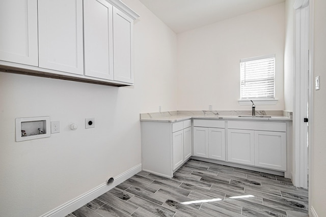 laundry room with cabinets, hookup for a gas dryer, sink, hookup for a washing machine, and hookup for an electric dryer