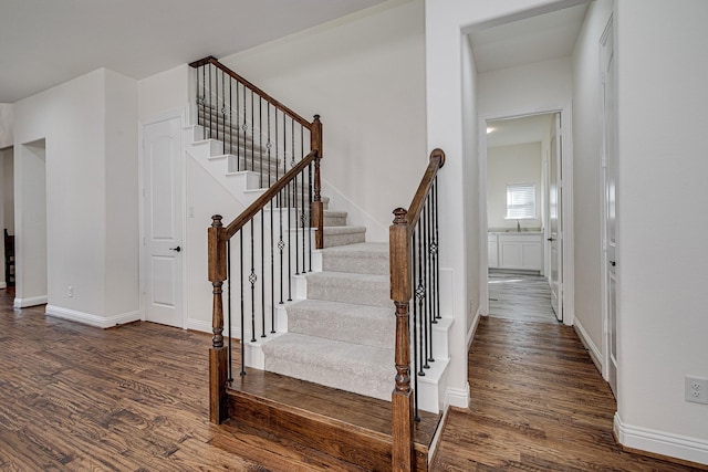 staircase featuring hardwood / wood-style floors