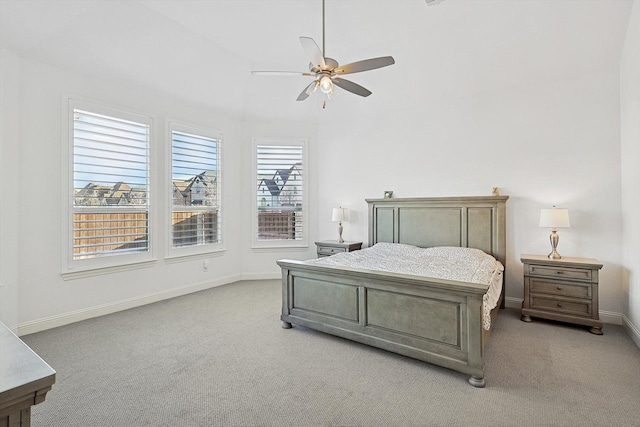 bedroom with ceiling fan and light carpet