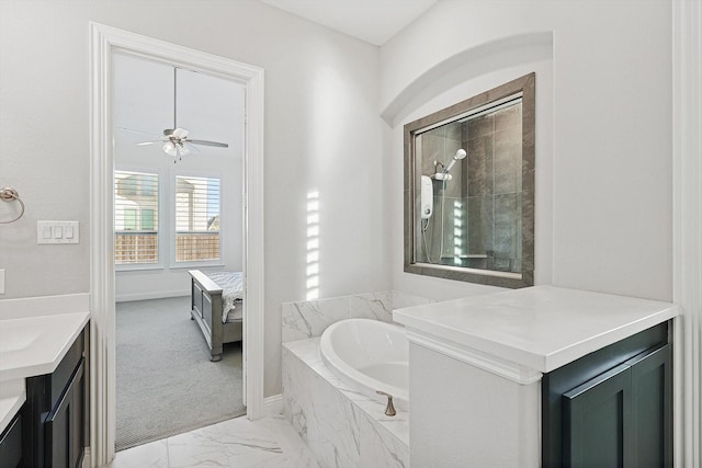 bathroom featuring ceiling fan, vanity, and plus walk in shower