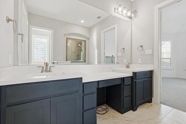 bathroom featuring vanity and a wealth of natural light