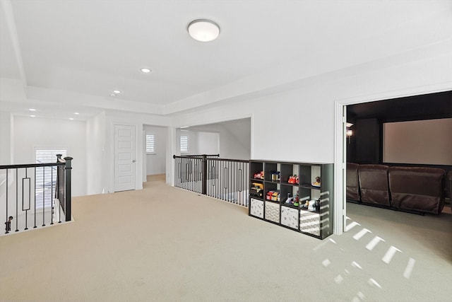 hall with carpet and plenty of natural light