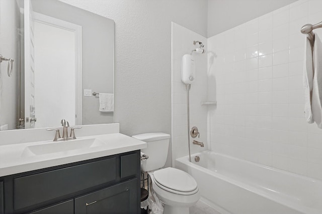 full bathroom featuring vanity, toilet, and tiled shower / bath combo