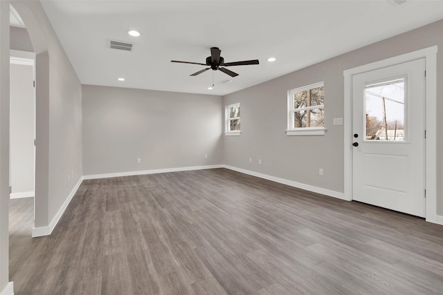 interior space with hardwood / wood-style floors and ceiling fan