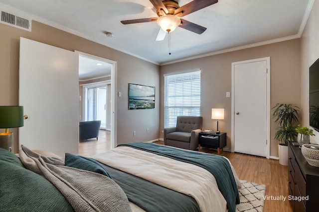 bedroom with crown molding, ceiling fan, and light hardwood / wood-style flooring