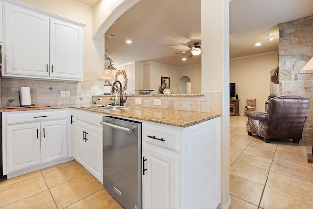 kitchen with white cabinetry, dishwasher, a peninsula, and a sink