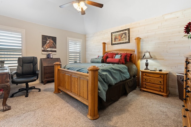 bedroom featuring lofted ceiling, a ceiling fan, and light colored carpet