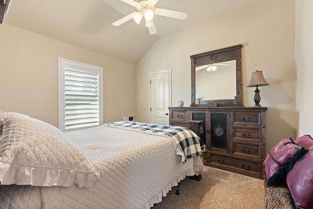 carpeted bedroom featuring ceiling fan and lofted ceiling