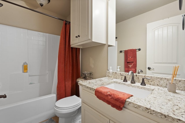 full bath featuring toilet, shower / bath combination with curtain, and vanity