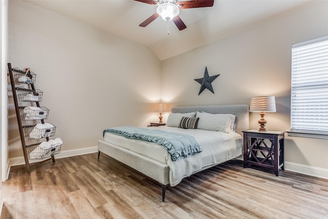 bedroom featuring vaulted ceiling, ceiling fan, and hardwood / wood-style floors