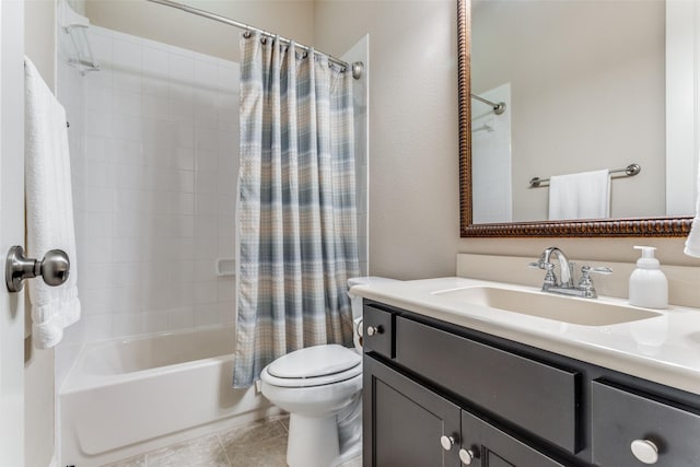 full bathroom with tile patterned floors, shower / bath combo with shower curtain, vanity, and toilet