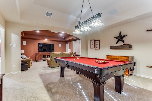 game room featuring light carpet, a tray ceiling, and billiards