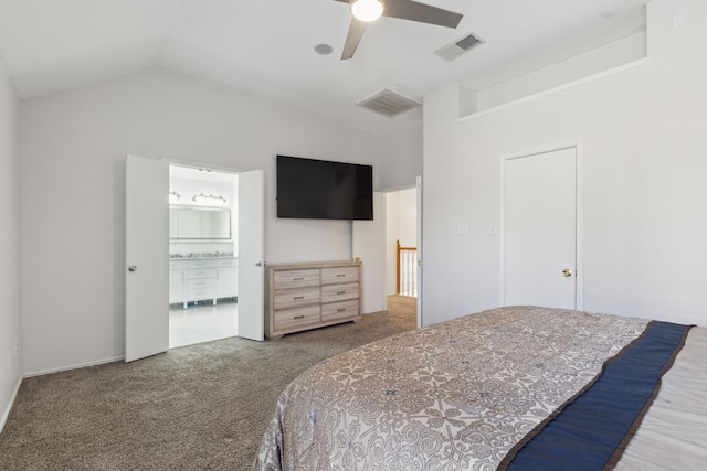 bedroom featuring carpet flooring, connected bathroom, vaulted ceiling, and ceiling fan