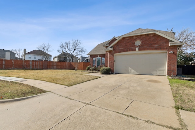 view of front of home featuring a garage and a front lawn