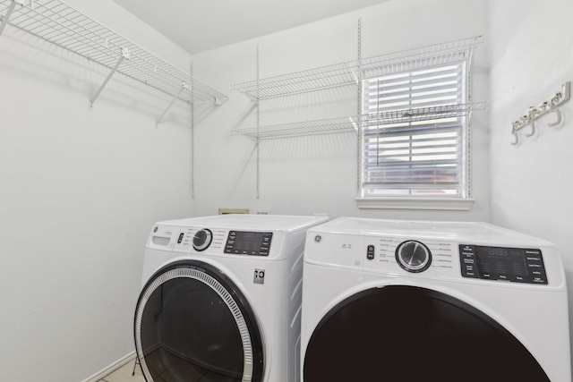 washroom featuring washing machine and dryer