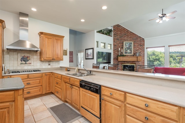 kitchen featuring backsplash, sink, a brick fireplace, wall chimney exhaust hood, and black dishwasher