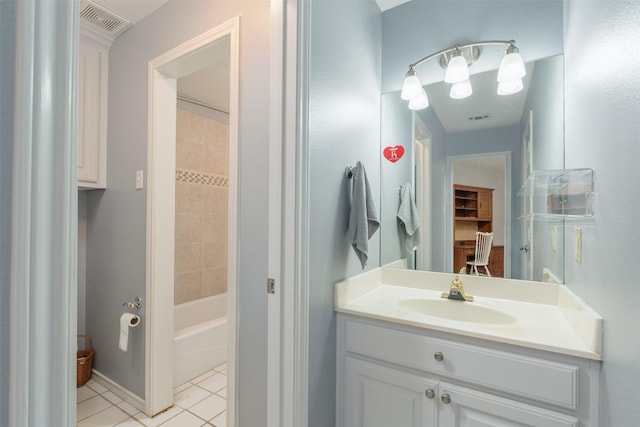 bathroom with tile patterned flooring and vanity