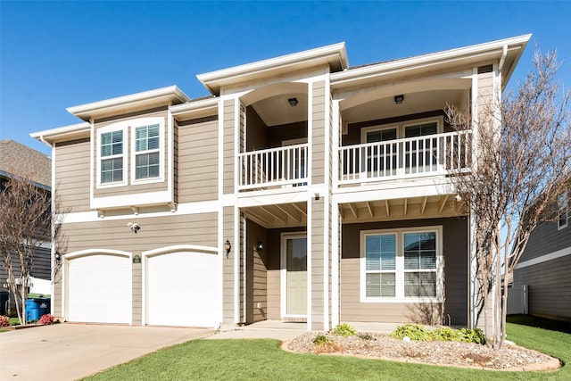 view of front of home with a garage and a balcony