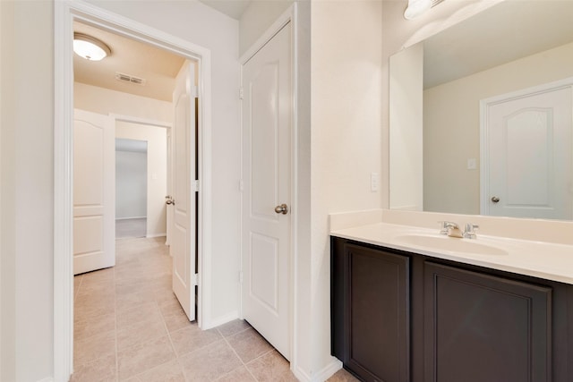 bathroom with vanity and tile patterned floors