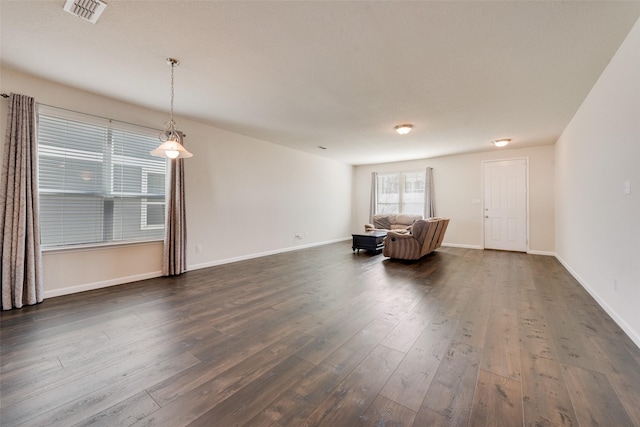 unfurnished living room featuring dark hardwood / wood-style floors