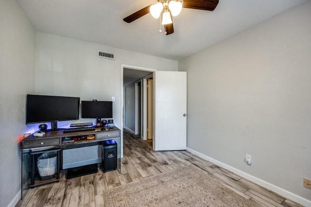 office featuring light wood-type flooring and ceiling fan