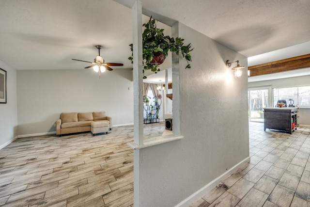 interior space featuring ceiling fan and lofted ceiling