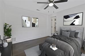 bedroom with ceiling fan and dark hardwood / wood-style floors