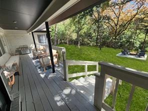 deck featuring a lawn